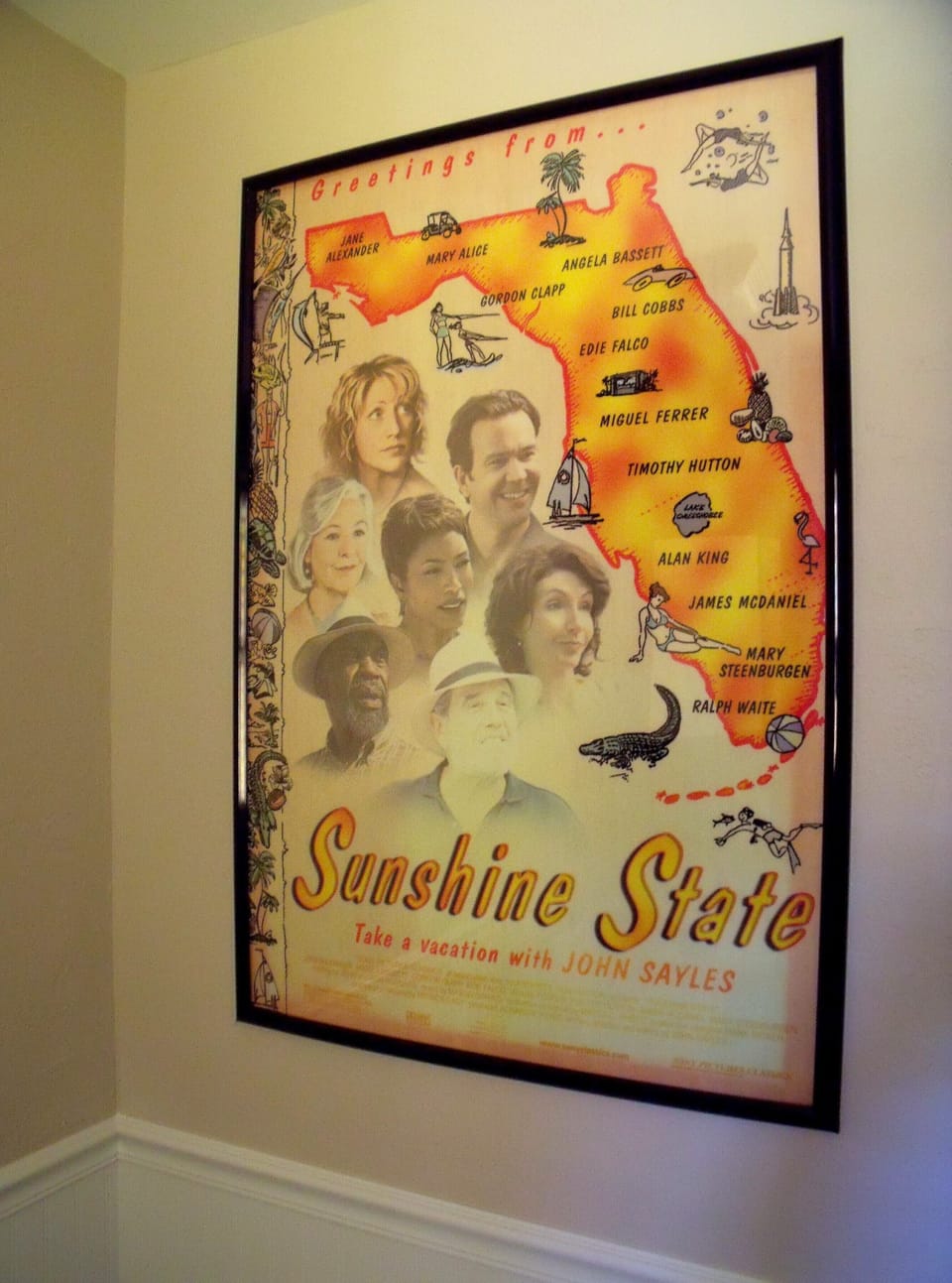 Fun bathroom art includes 'The Sunshine State' movie poster. 