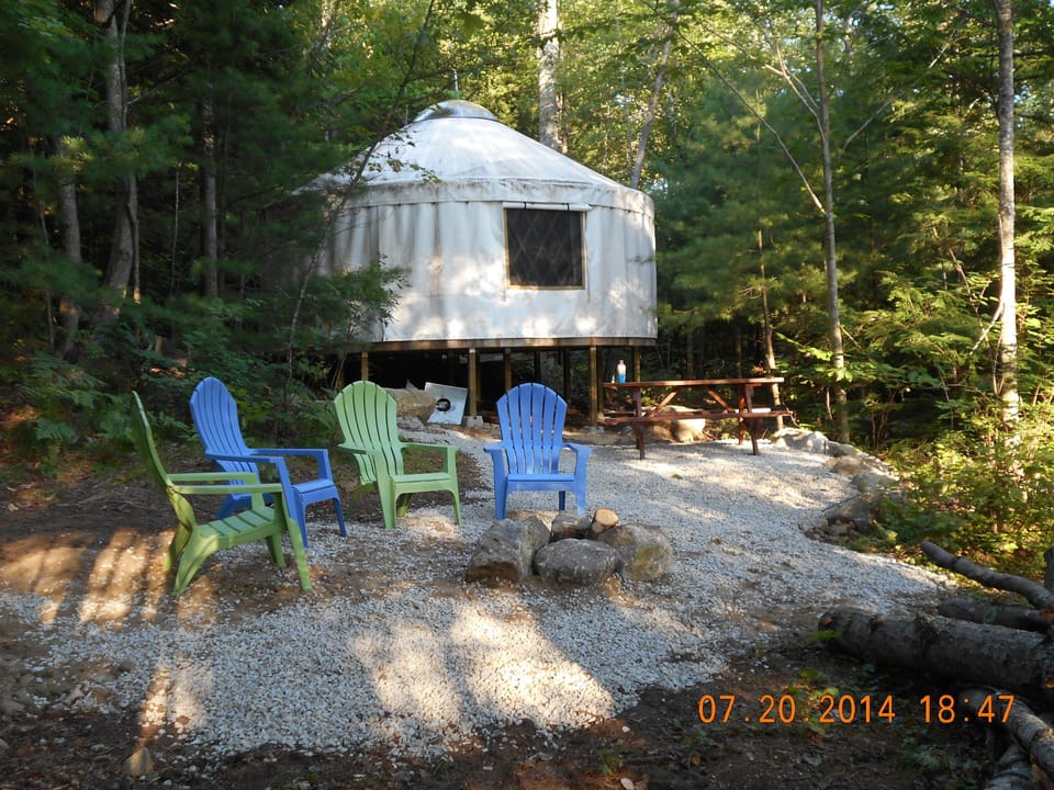 The back of our yurt with the cozy fire pit area