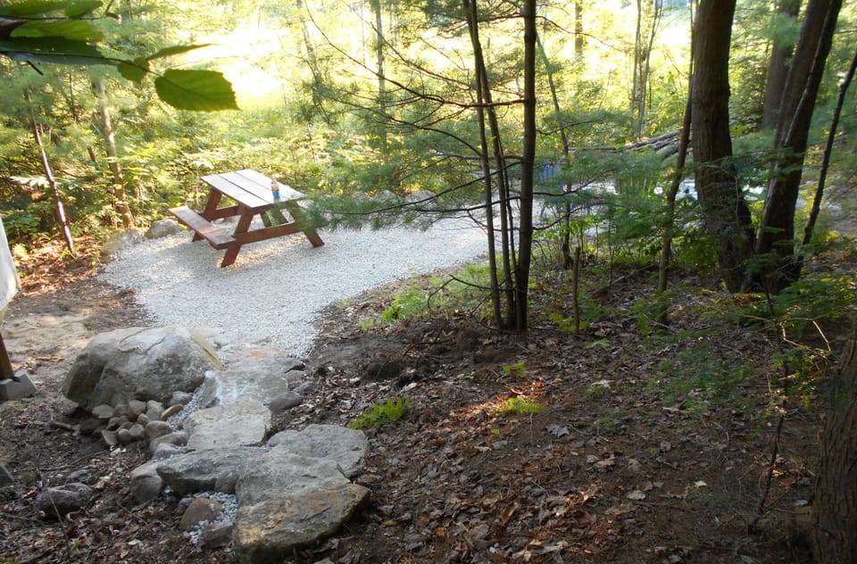 Our custom stone steps leading to the picnic/firepit area