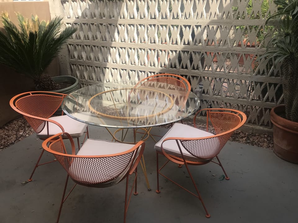 East facing, private patio with dining table accessed from Living Room. Walled.