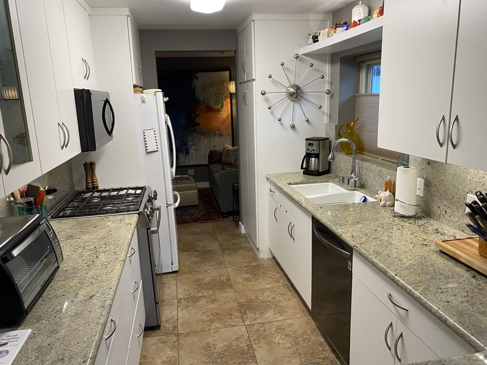 Kitchen with den at the end of the photo