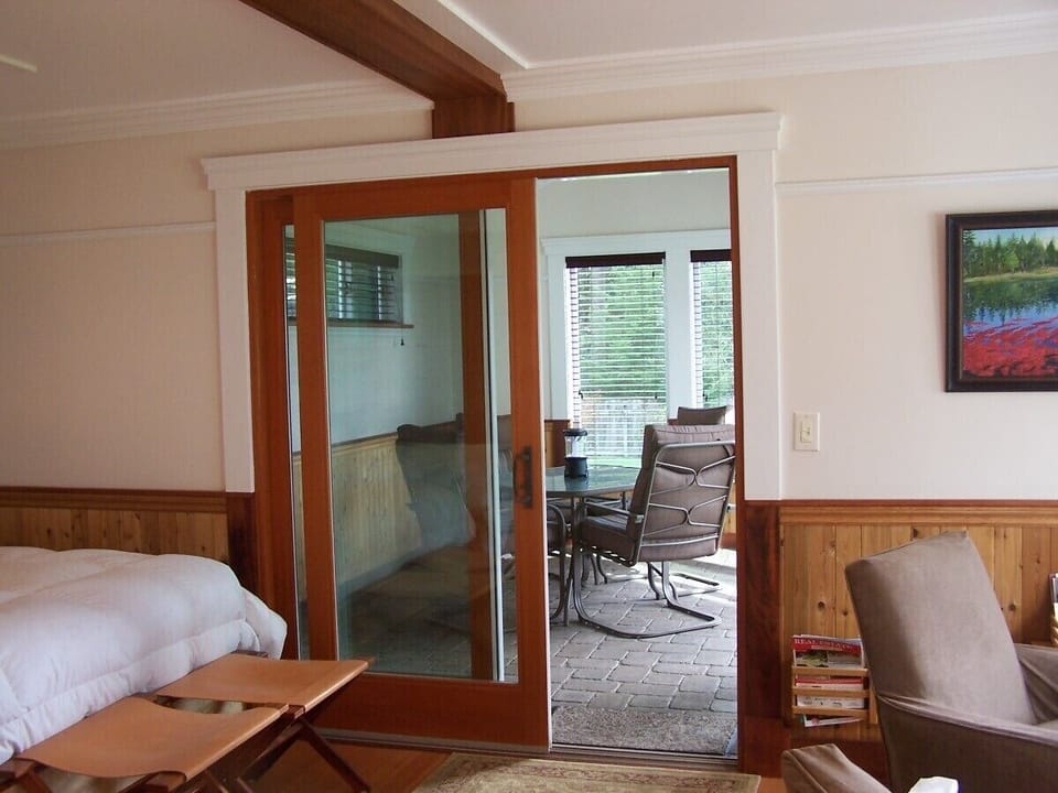 East Suite view from bedroom into enclosed patio (each Suite identical)