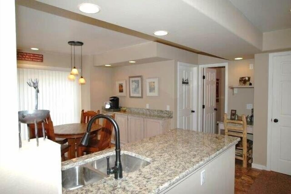 Kitchen has nice serving bar and a small work desk too.
