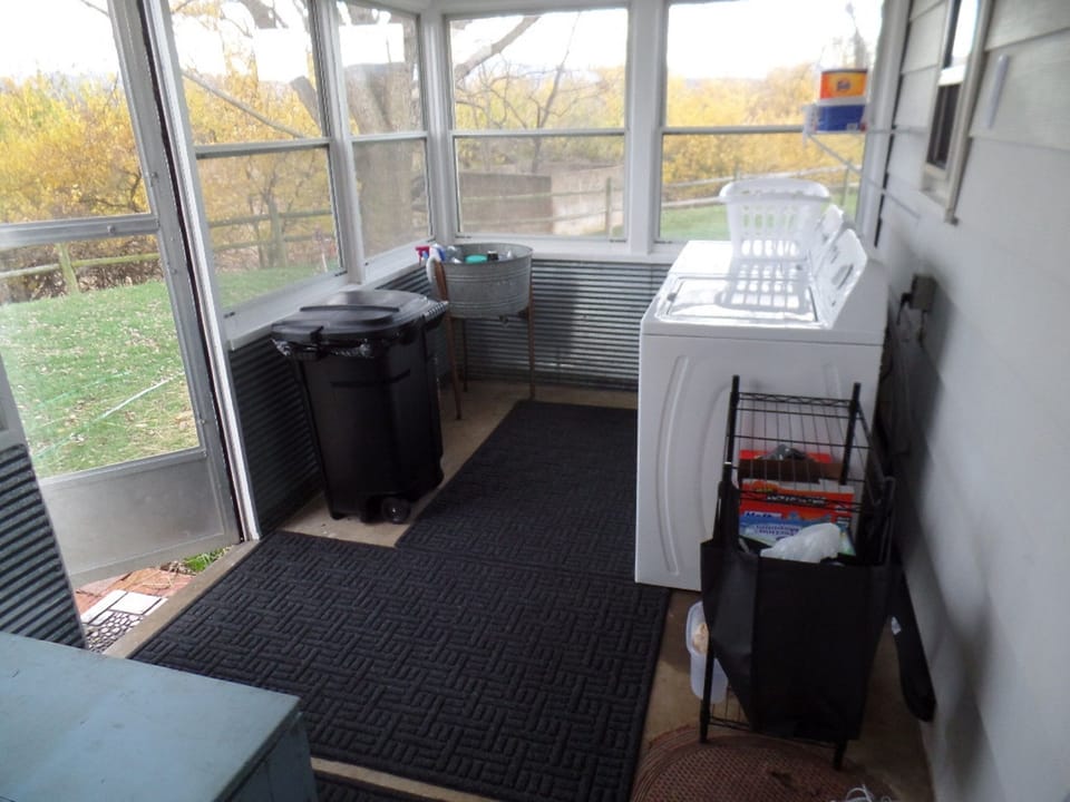 Laundry area, ski storage and back entrance.