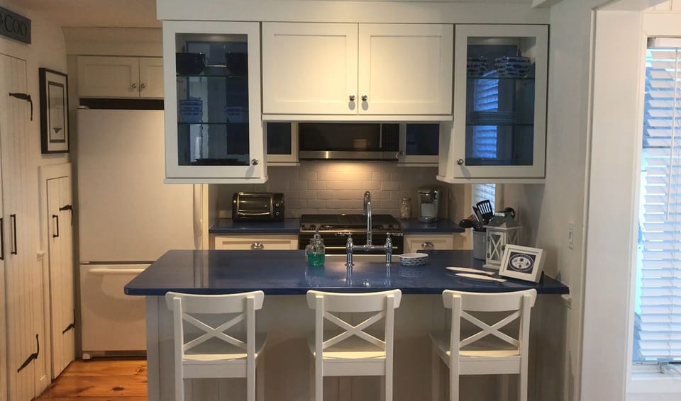 Updated kitchen with new island stools and blue cottage stone countertop!