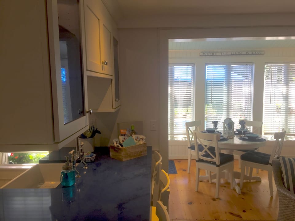 View from kitchen island towards new dining area table and chairs.