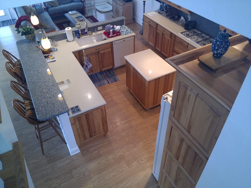 Another kitchen view showing bar seating for 4.