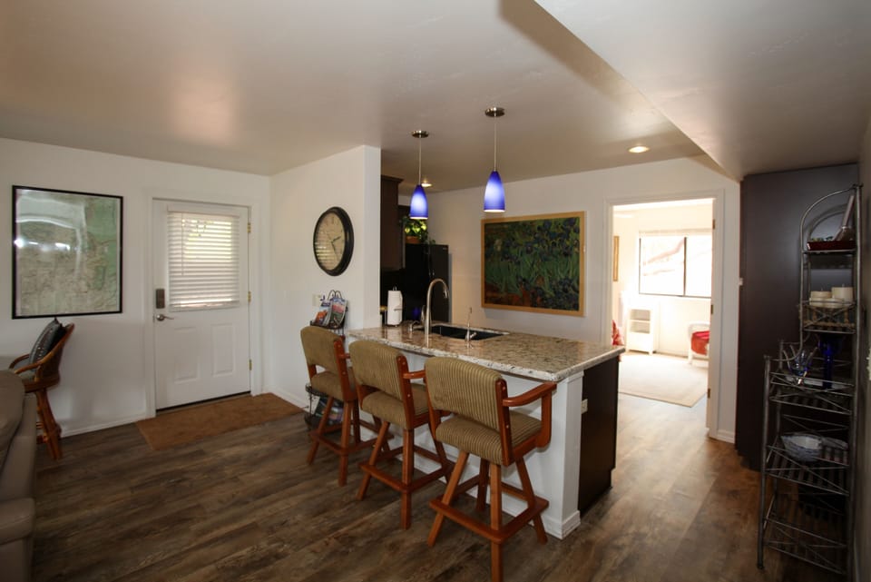 Great room from living room, kitchen and on to back, sunny bedroom; forest view!