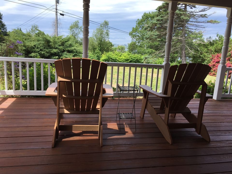 Front porch with ocean and sunset views.