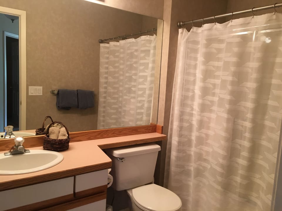 Full bathroom downstairs across from the first bedroom