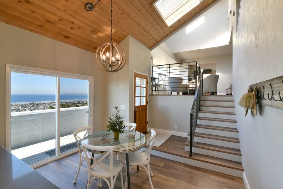 Enter through the front door into the dining area, stairs to living area and bedrooms