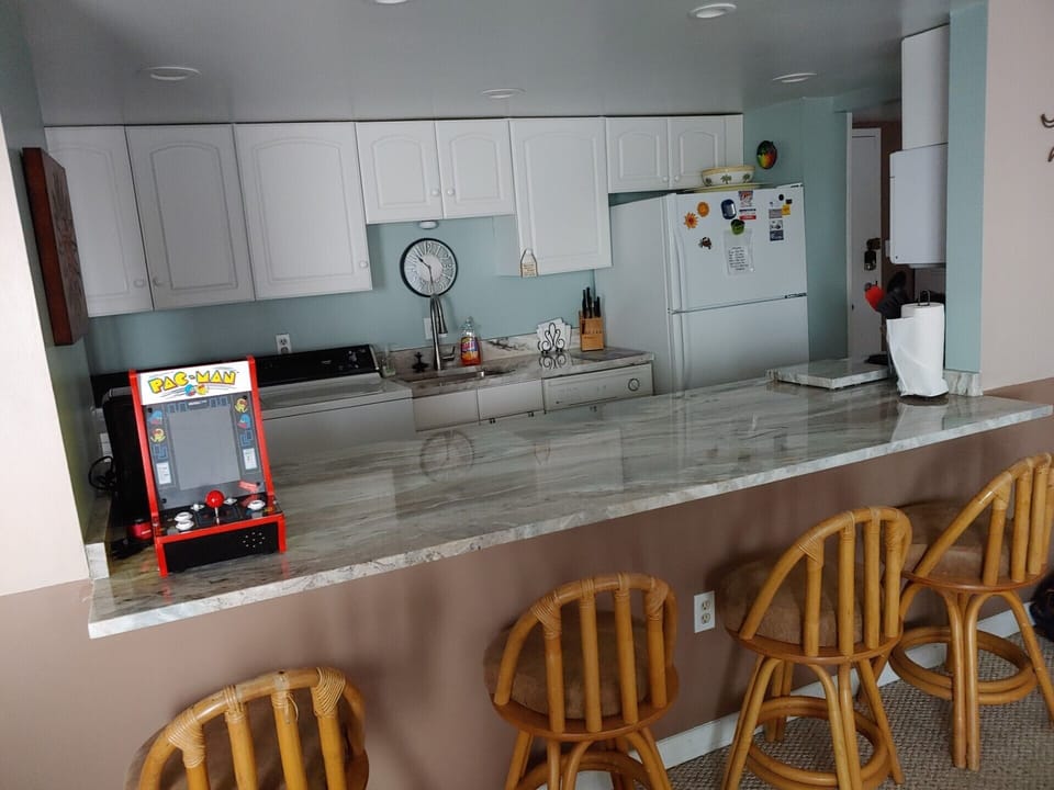New granite kitchen counters with Pac Man game...