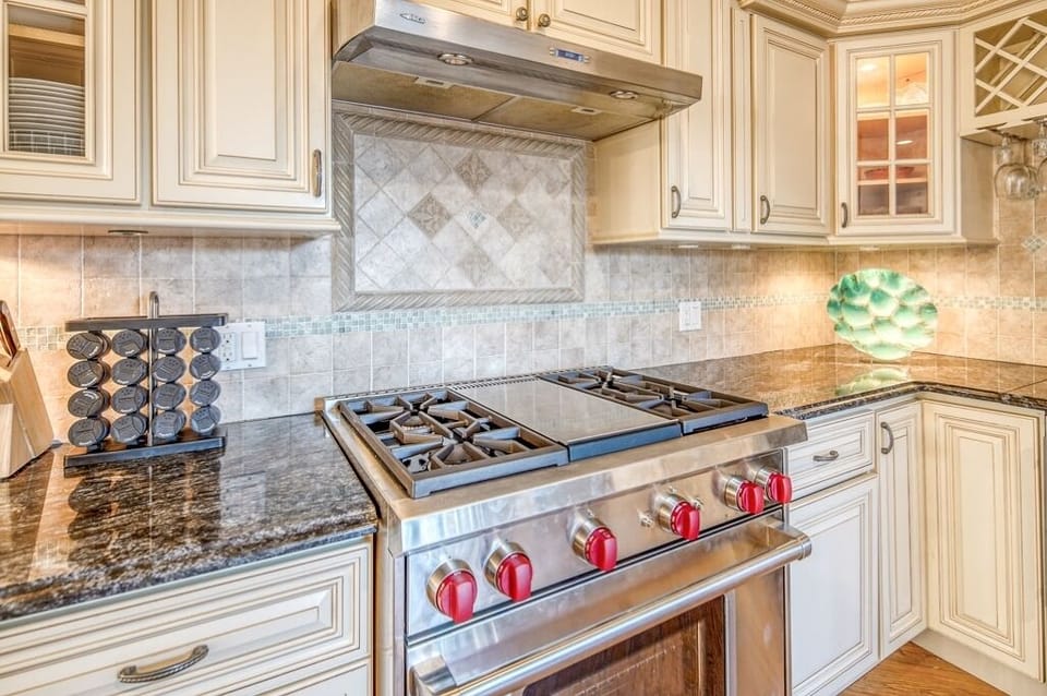 New Wolf commercial stove, Granite counters, stainless appliances