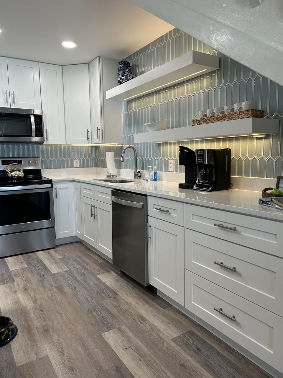 The kitchen is well-stocked with pots, pans, & dishes for cooking & dining in.