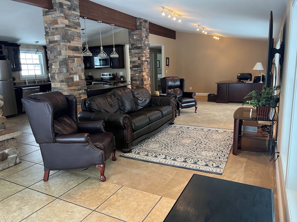 Large living room, kitchen and dining room to congregate with family &  friends