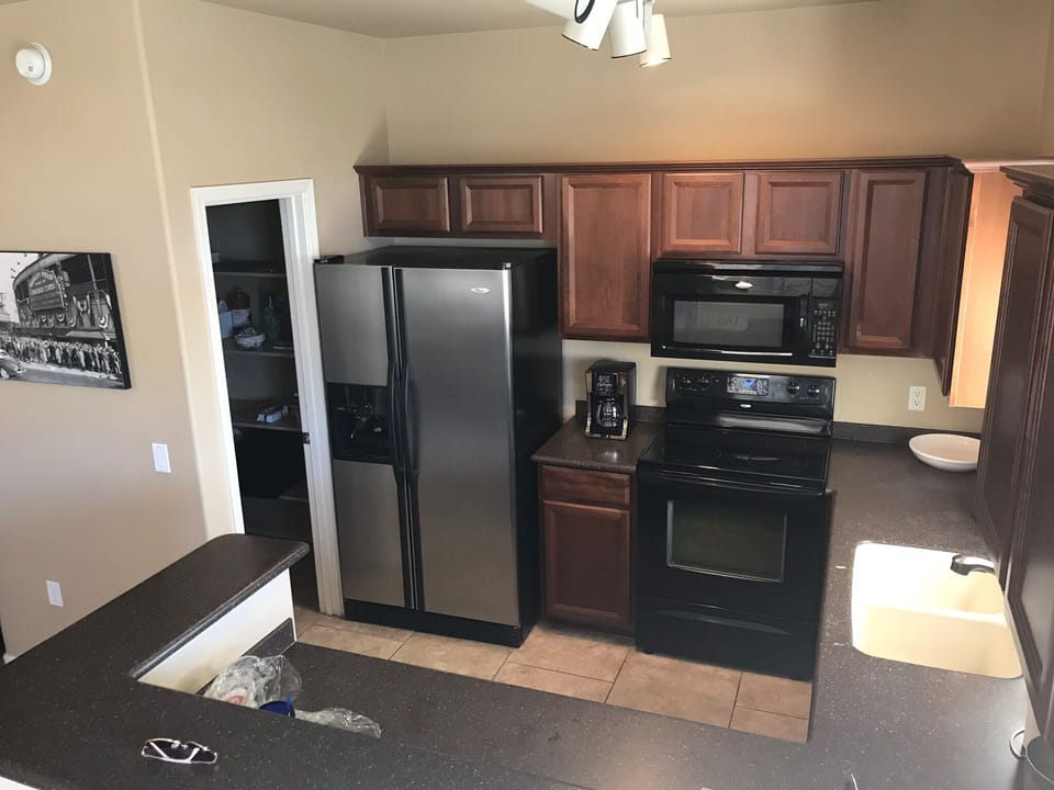 Open concept kitchen, stocked with all of the necessities and a large pantry 