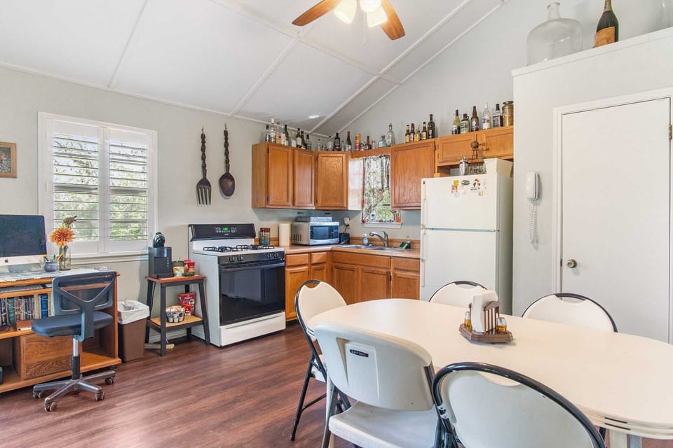 Your home-away-from-home kitchen! Our vacation rental offers a fully equipped kitchen with dining area and a convenient workspace, perfect for both culinary creations and catching up on tasks.