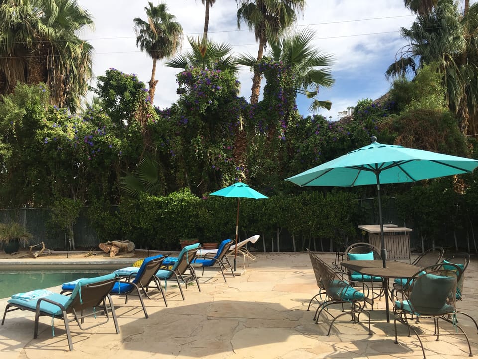 Outdoor Bar, Sandstone Patio with Umbrella's Lounge Chairs  2 -Tables of 6 Great