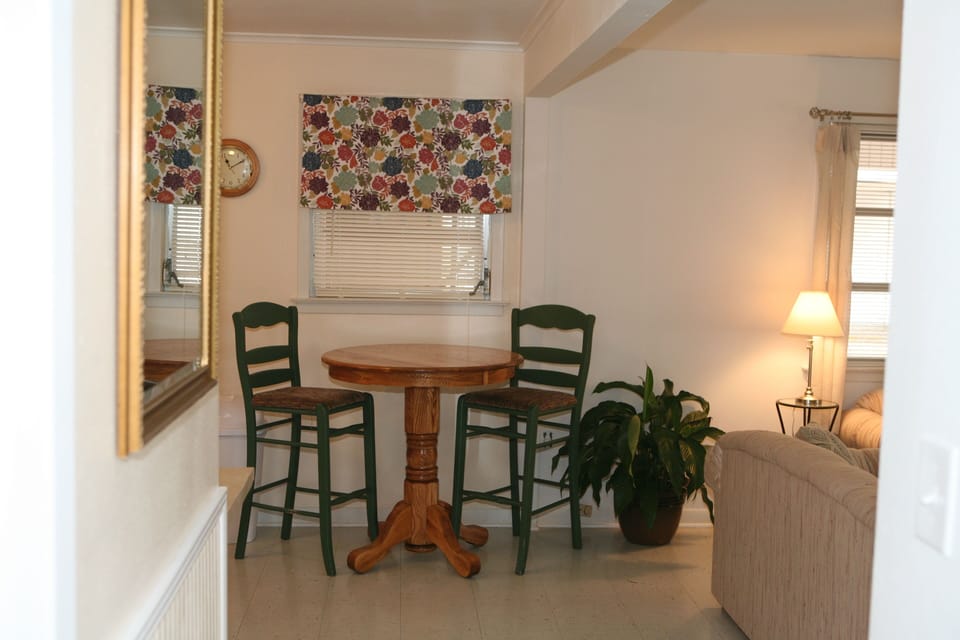 View from the hallway --- Oak bar table in the kitchen.