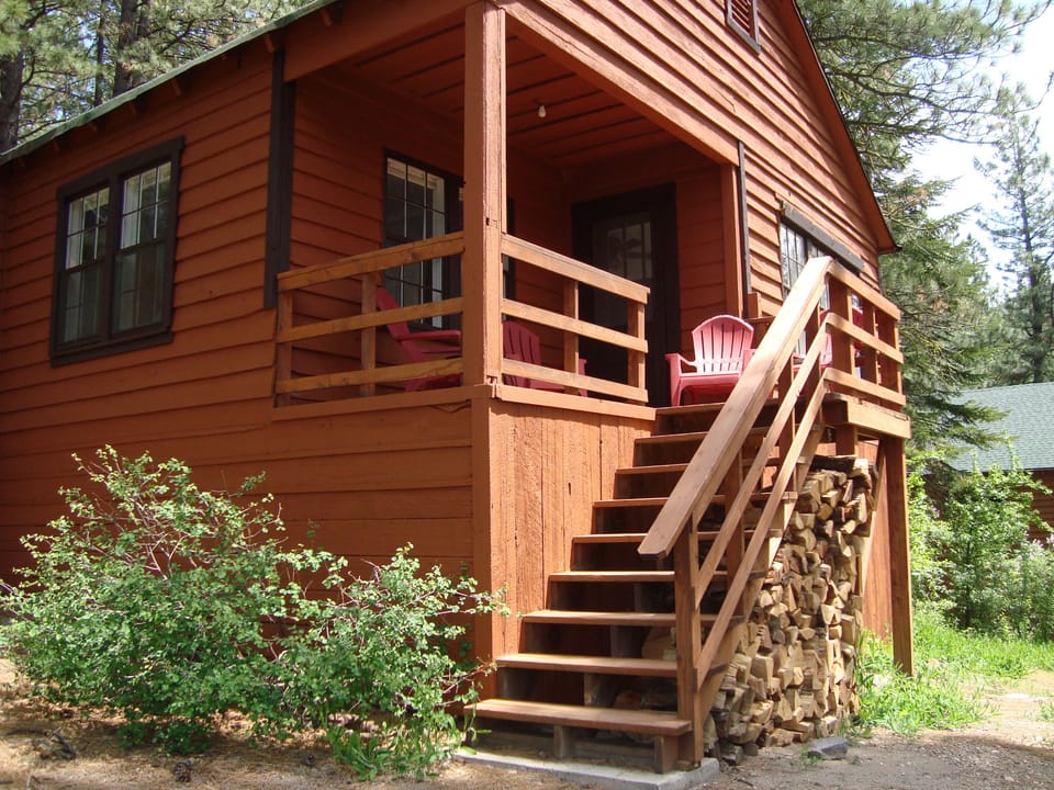 Back deck with 4 Adirondack chairs for lounging and listening to the river