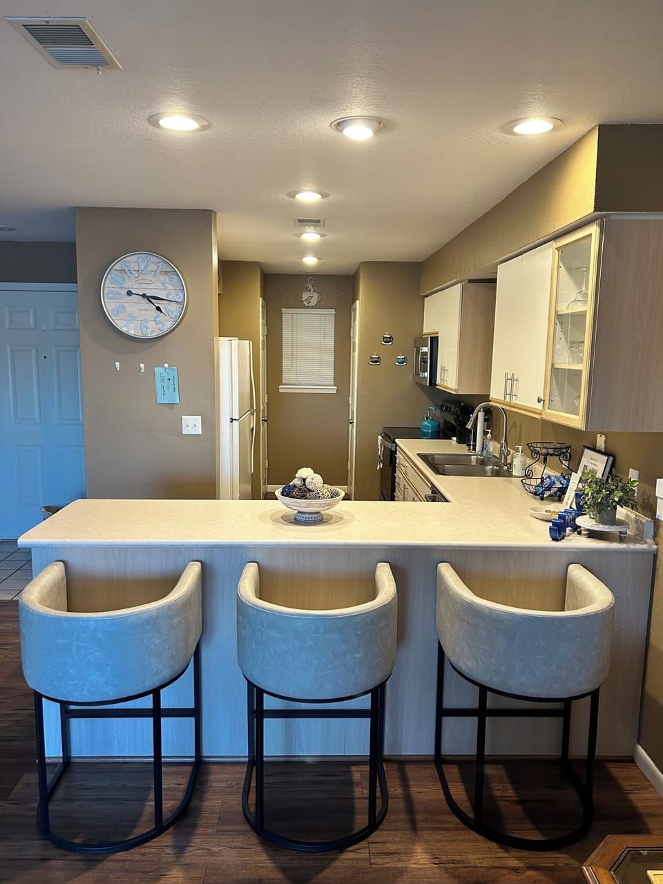 Ample kitchen counter space for prepping meals & additional seating.