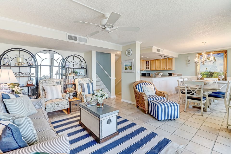 Living Area with Ample Seating, Large Flat Screen TV and Balcony Access
