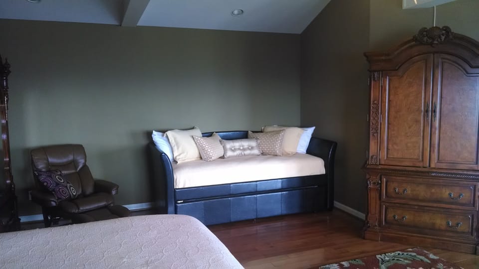 Trundle with an XL twin mattress on top and regular twin on bottom.
