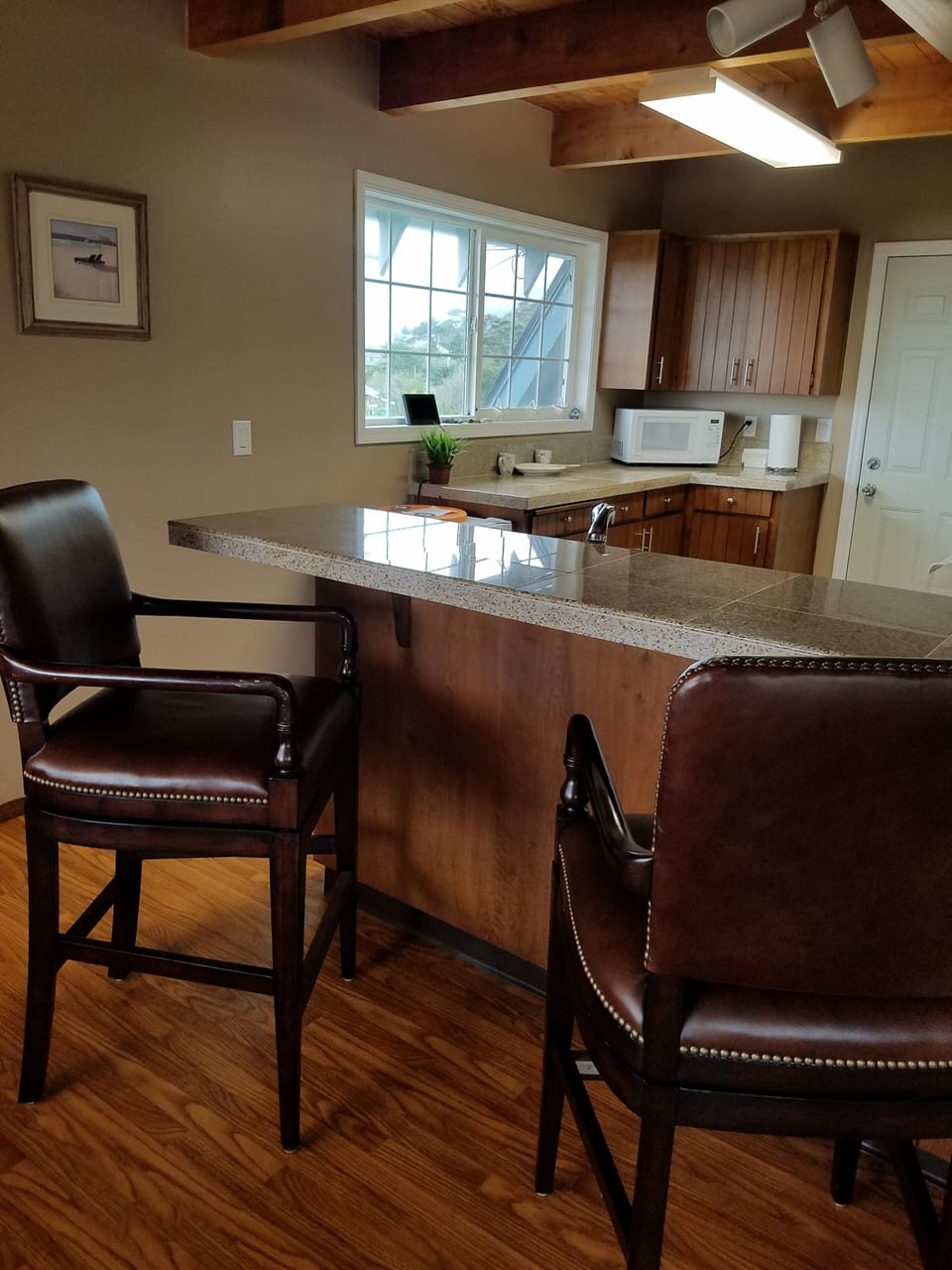 Enjoy relaxing on our luxurious Pottery Barn Calais leather bar stools