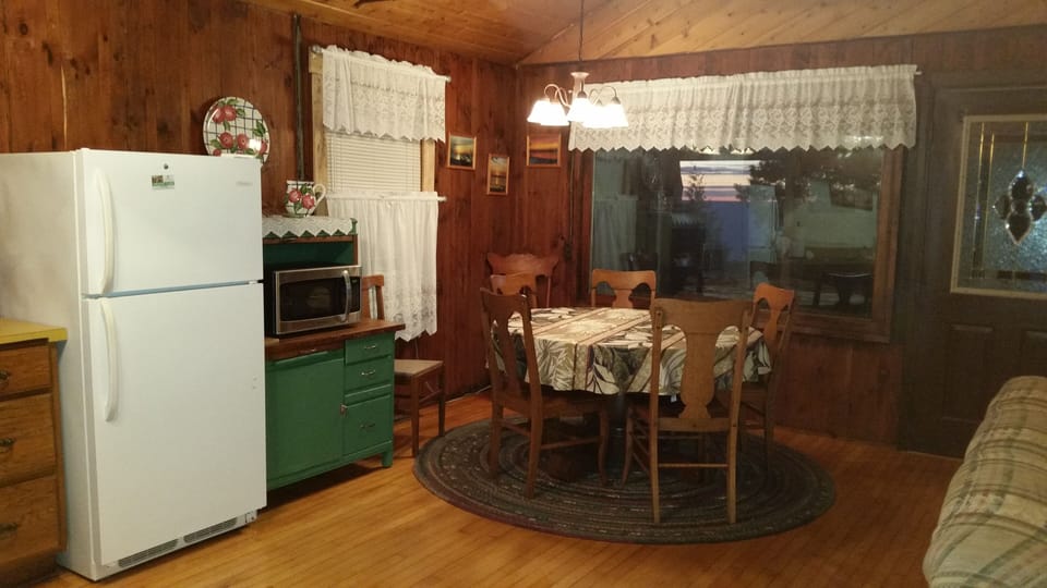Enjoy the view while dining in our open living area at our Isle View Cabin.
