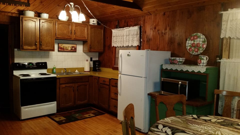 Our open kitchen is furnished in full.