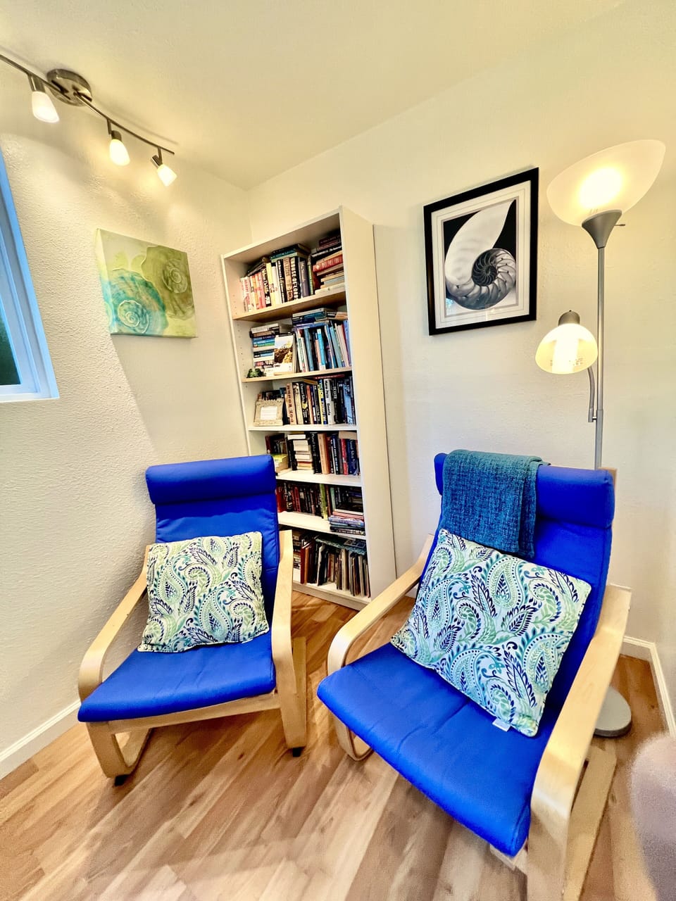 Reading alcove with lots of books for all ages. A shelf is just for kids & teens