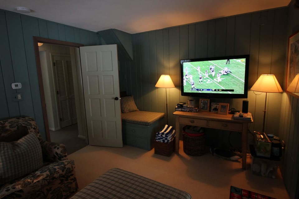 away from the action of the great room, den offers a relaxing atmosphere