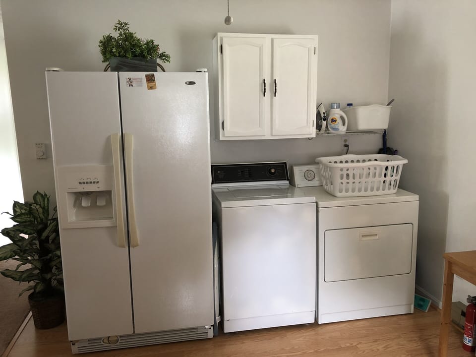 Full size fridge and washer and dryer.