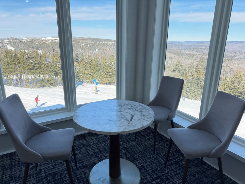 Public  seating area in the common space. View of the slopes and lake.