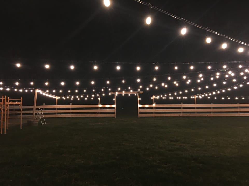 Canopy of lights over hillside view reception area