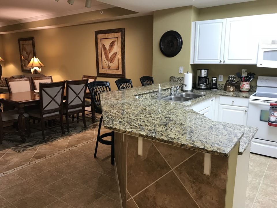 Dining table seats 6 - 10, Breakfast bar seats an additional 3. A total of 13!