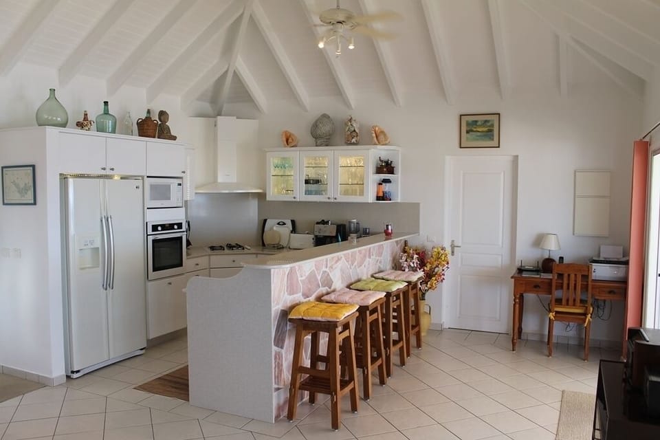 Fully Equipped Kitchen & Snack Bar...Office Desk Area On Right.