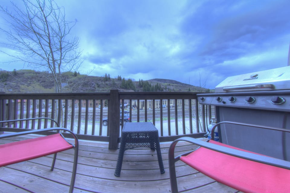 Deck with furniture and grill.