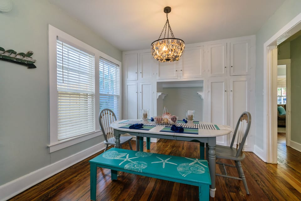 Dining table seats 6. Original built in cabinets provide extra storage space