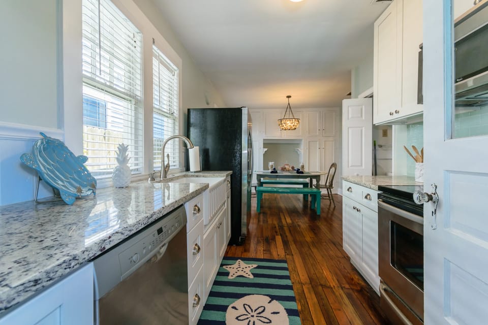 Beautiful granite countertops and shaker style white cabinets