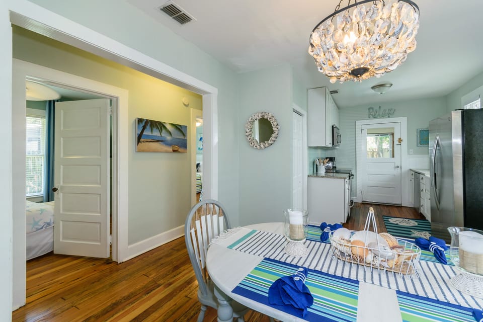 Enjoy meals under the gorgeous oyster shell chandelier