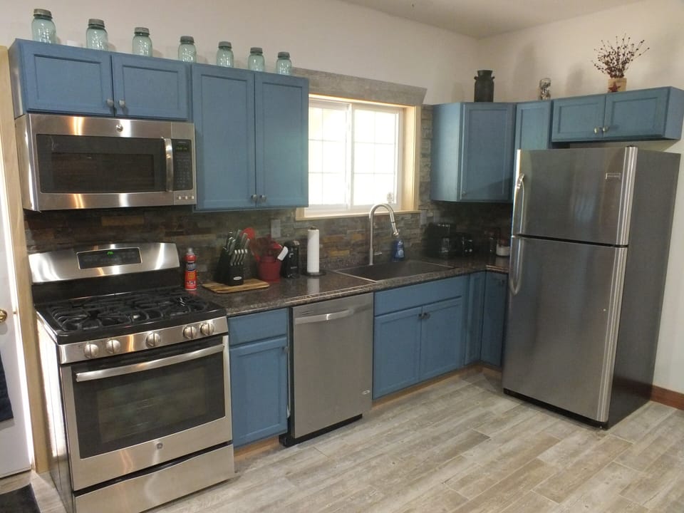 Stainless Appliances. Everything is here for you, coffee, pots, pans, spices...
