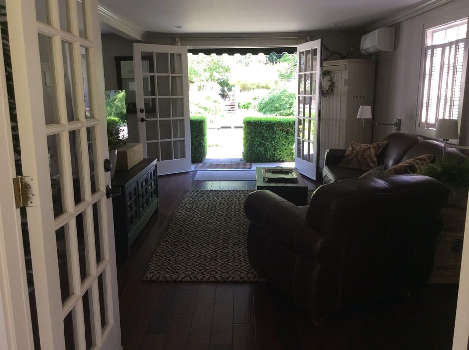 Two sets of French doors allow the outside in...