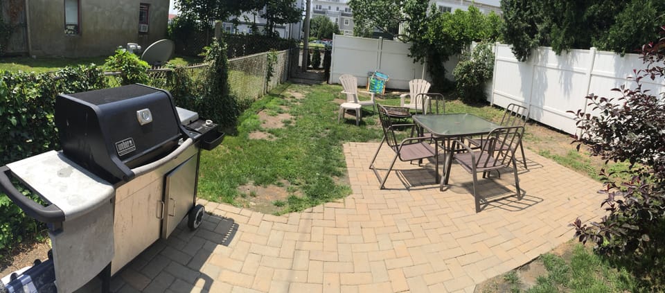 Private backyard with grill, table/chairs and firepit.  Private access in back