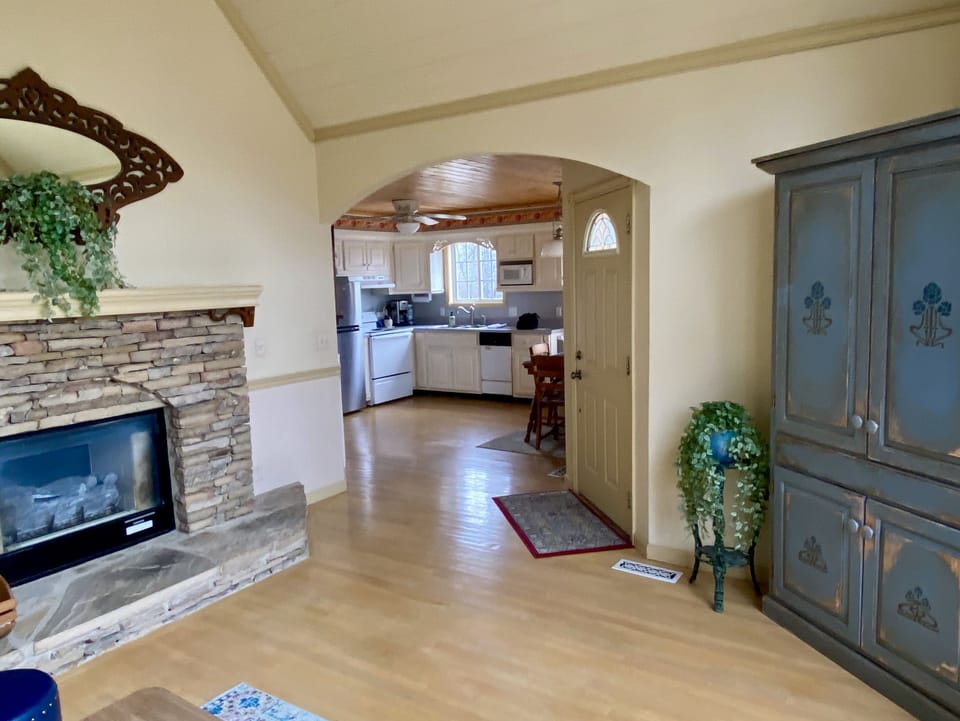 View to kitchen from living room. HD flat screen TV is inside the armoire 
