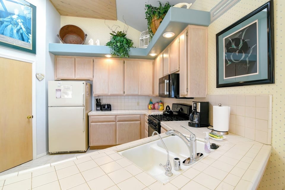 The kitchen offers a large counter space for prepping meals and a pantry for food storage