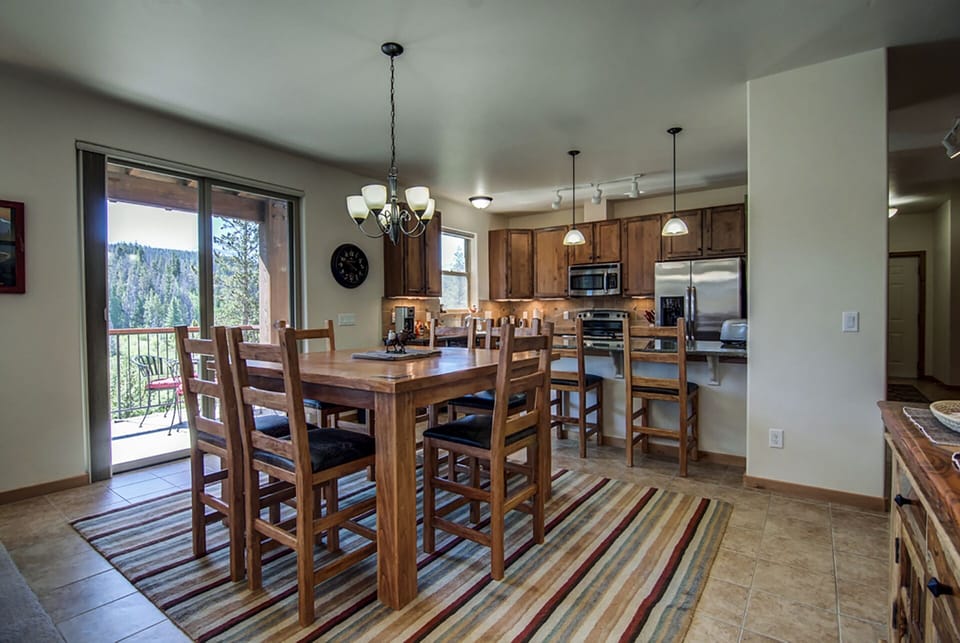 Dining Room - sliding door out to the back deck with great views and gas grill.