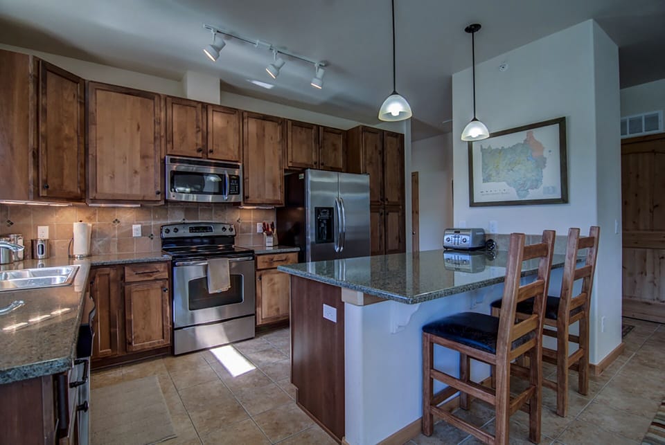 Kitchen island can seat 3 comfortably for dining.