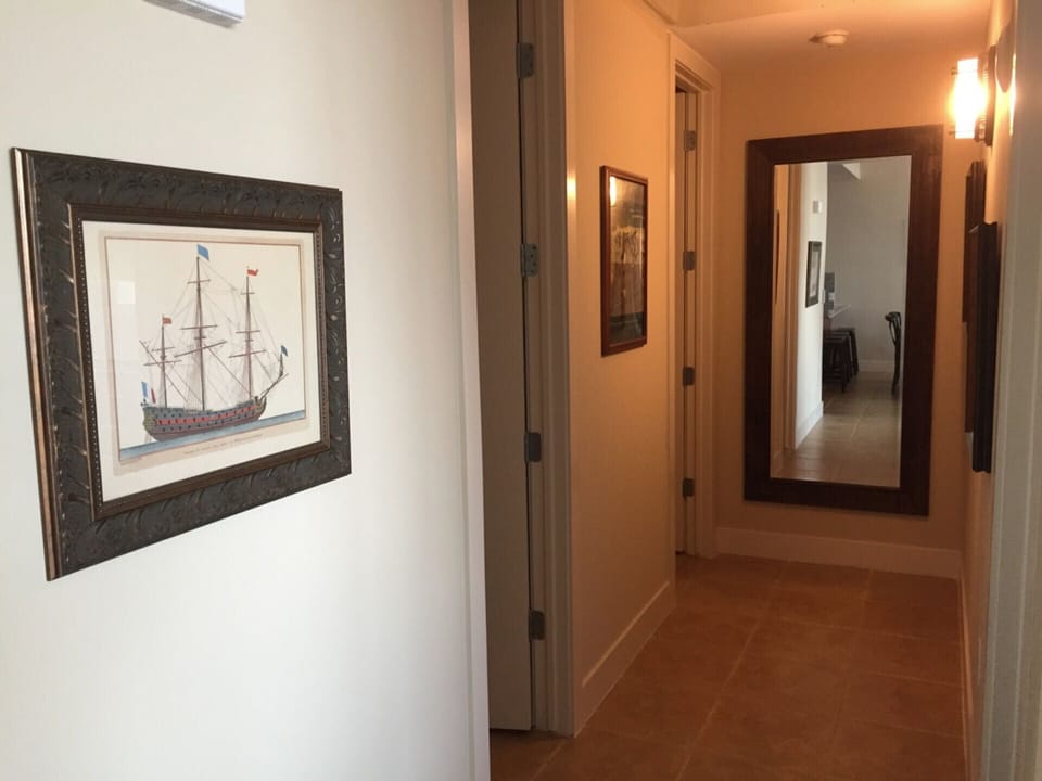 hallway to half bath and bedrooms