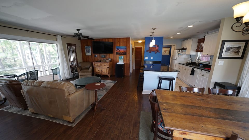 Dining table for 6 with 5 seats at the kitchen counter.